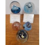 Four Caithness glass paperweights to include Splashdown and Quicksilver, both designed by Colin