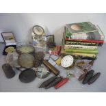 A mixed lot to include clock parts, golf related books, zippo lighters, costume jewellery and