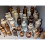 A collection of approximately 50 stoneware bottles, in various colours Location: LWB