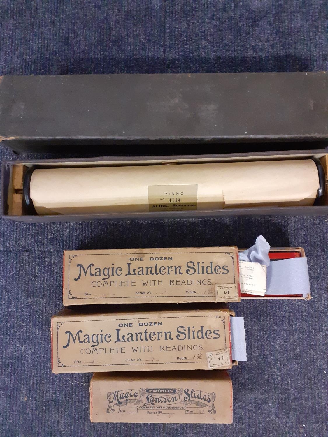 A quantity of Magic lantern slides in three sets to include Balloon & Flights, together with a piano