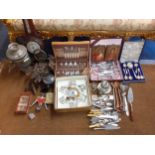 A mixed lot to include mid 20th century cutlery and flatware, silver plated items, a cuckoo clock