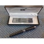 A black check ballpoint pen with additional refills and box (NOT a Mont Blanc) Location: Porter