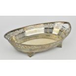 A Continental silver pierced basket dish, stamped 800, of oval form with beaded rim above a