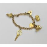 A 9ct yellow gold curb chain charm bracelet, with five various whimsical charms, to include one of