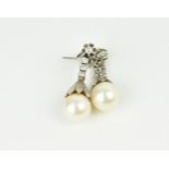 A pair of white gold, diamond and pearl drop earrings, the four diamonds on articulated white gold