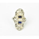 A white metal, diamond and sapphire tablet dress ring, with three central brilliant diamonds