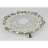 An Edwardian silver salver by Martin, Hall & Co, Sheffield 1909, the scalloped border with shell and