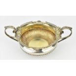 A George III silver and silver-gilt twin handled bowl by William Elliott or William Eaton, London