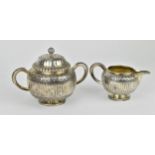 A French silver lidded sugar bowl and milk jug by Maison Odiot, 1838-1972 .950 standard, stamped