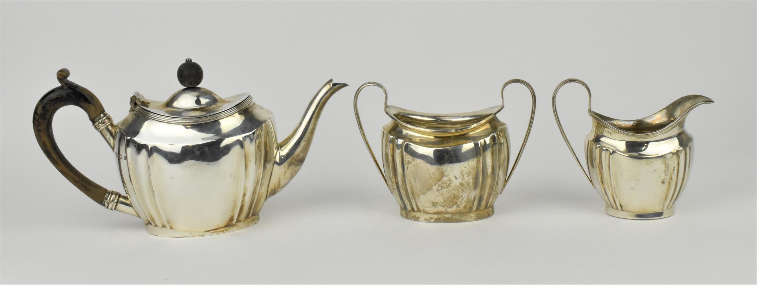 A George V silver three piece tea set by S Blanckensee & Sons Ltd, Birmingham 1919, comprising one