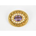 A Victorian yellow metal, amethyst and pearl locket pendant brooch, of oval form with beaded border,