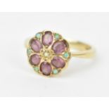 A 9ct yellow gold, amethyst and opal flower ring, the six oval cut amethysts formed as petals with