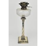 An Edwardian silver oil lamp by the Goldsmiths and Silversmiths company, London 1907, in the Adams