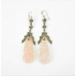 A pair of silver, pink quartz and marcasite drop earrings, the pink quartz with pierced and carved