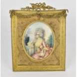 A 19th century French oval portrait miniature of a lady, in the late 18th century fashion with large
