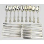 A set of nine American sterling silver egg spoons with faceted bowls and pierced terminals, together