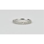 An 18ct white gold and diamond half eternity ring, set with fifteen brilliant cut diamonds in