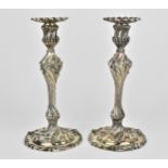 A pair of William IV silver candlesticks by Paul Storr, London 1837, in the rococo style, each of