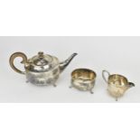 A George V silver three piece tea set by Albert Edward Jones, Birmingham 1918, comprising a