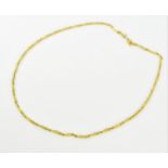 A yellow metal chain with textured links, 49 cm long, with stamped Chinese characters to the