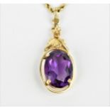 An Edwardian 14ct yellow gold chain and yellow metal and amethyst pendant, the rope twist chain