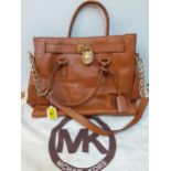Michael Kors- A brown reptile effect handbag with additional gold tone chain and leather shoulder