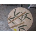 A circular marble table with floral inset, 52cm x 42cm dia Location: