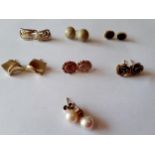 Seven pairs of gold and yellow metal earrings, testing as gold, to include a pair of 9ct and pearl