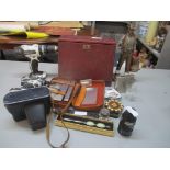 A mixed lot to include a leather bound desk set, John Wayne figure, Zenit camera, hip flask and