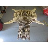 A 20th century zebra skin rug, 290cm long Location: BWR