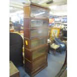 An early 20th century Globe Wernicke style oak sectional bookcase with glazed fronted doors and