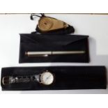 A Pierre Balmain gold tone and silver tone roller ball pen with branded case, a gents quartz watch
