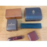 A Victorian silk padded jewellery box, a vintage tan leather Longines watch box, a Baume & Mercier