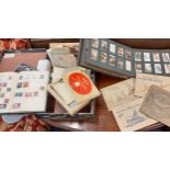 A small quantity of loose worldwide stamps, a small album with contents together with early 2th