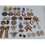 Vintage brooches to include a Trifari gold tone and pearl effect example, 2 Swiss Fuhrmann pottery
