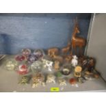A mixed lot to include glass paperweights, African wooden animals, Wade tortoises and other