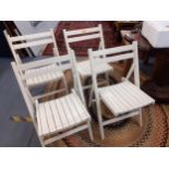 Four vintage and painted, folding slatted chairs Location: A1