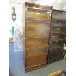 An early 20th century Globe Wernicke style oak sectional bookcase with glazed fronted doors and