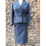 Norman Hartnell- A 1960's ladies blue tweed 2-piece skirt suit having a fitted waist to the