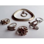 Contemporary silver costume jewellery stamped 925 comprising 5 rings, a bangle and a pendant,