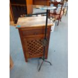 A small hardwood bedside cabinet with fretwork door together with a wrought iron, floor standing