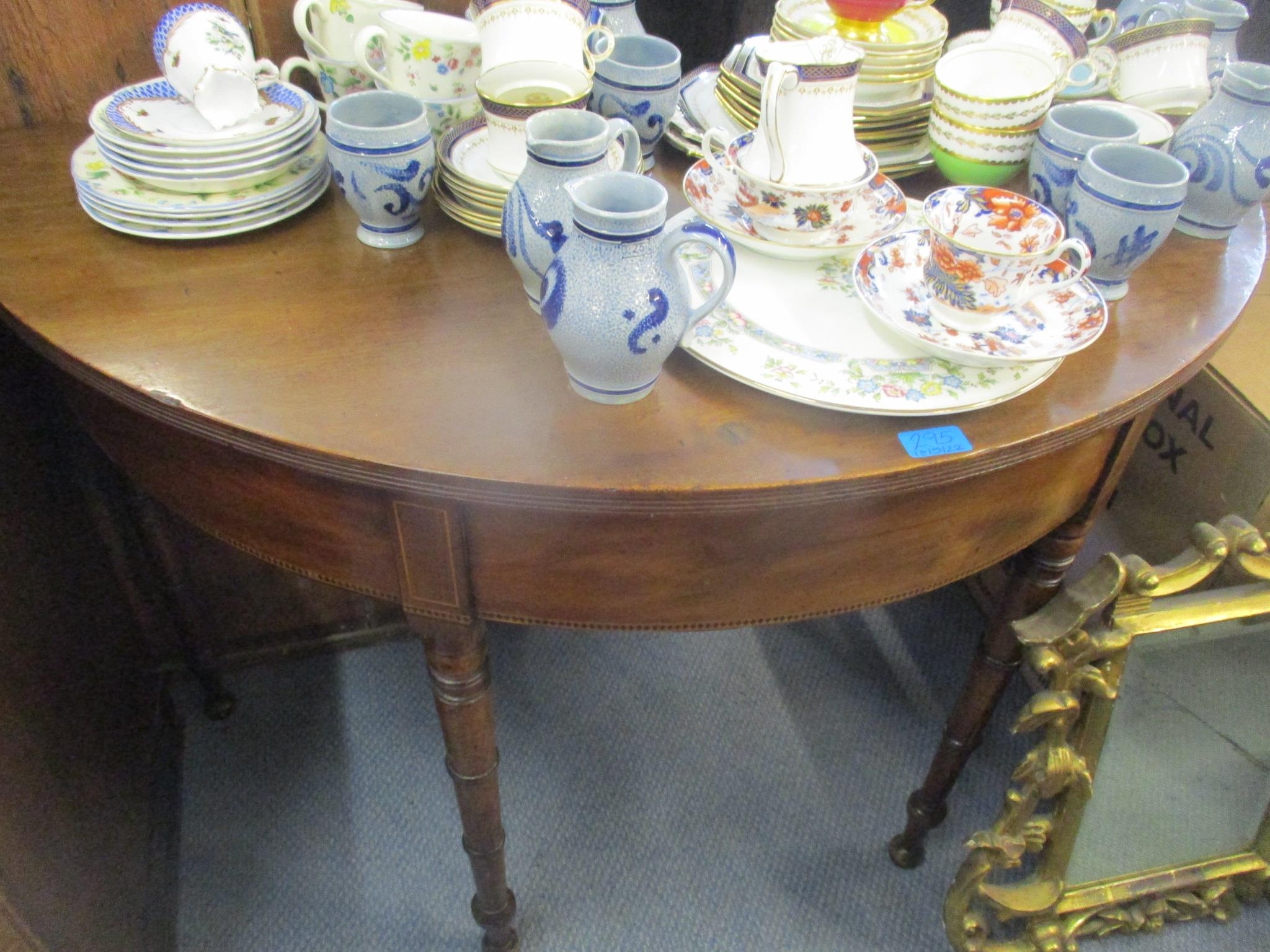 A Regency mahogany dining table comprising two demi lune ends, on turned tapered legs, 72cm x - Image 2 of 2