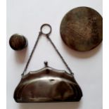 An early 20th Century silver bag with metal chain together with a white metal engraved compact and a