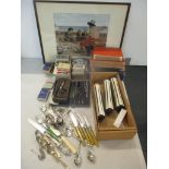 A mixed lot to include a framed print, books, cigarette cards, scientific equipment, cutlery and