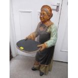 A composition waiter fashioned as an elderly woman holding a tray, 96h, Location:G