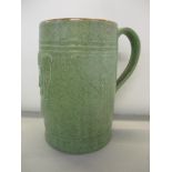 A large Royal Doulton salt glazed, stoneware mug incised to the base, WTL & S 1929 and numbered