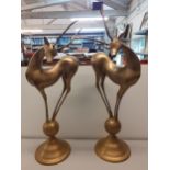 A pair of late 20th century Art Deco style model deer, on a ball and plinth, 75cm h, Location: BWR