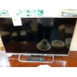 A Sony flatscreen television, 31" screen on stand with remote but no cables, Location: LWM