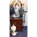 A small hardwood bedside cabinet with fretwork door together with a wrought iron, floor standing