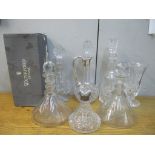 Glass to include decanters, one with a silver collar and a claret jug with a silver clad handle